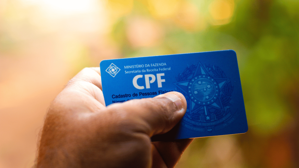 Close-up of a CPF card with the words "CPF Contribution Rate 2024" overlaid in bold text.